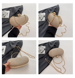 Macro detail of champagne gold evening clutch bag with petal clasp and metallic fabric