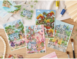 Detail of artistic 3D stickers with hand-painted fairytale scenes on a creative desk