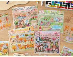 Detail of artistic floral miniature stickers on wood table with watercolor props