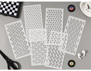 Set of six white PET stencils with geometric and star patterns for DIY art painting