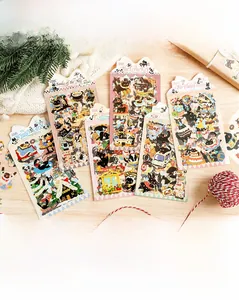 Detailed PET cat stickers on wood surface with cozy winter and party themed illustrations