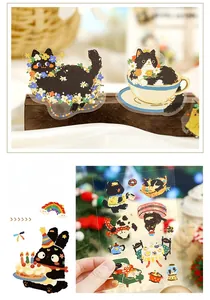 Close-up of cute black cat stickers for DIY planners and phone case decorations