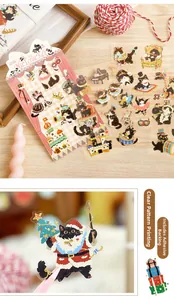 Detail view of black cat PET stickers featuring nutcracker and Christmas themes with self-adhesive