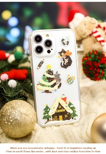 Close-up of a festive Christmas black cat pattern on a clear iPhone phone case