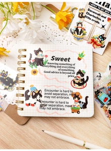 Black cat stickers set with inspirational quotes on grid notebook decoration