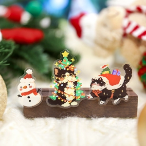 Cute black cat and snowman Christmas acrylic stand set on a warm wooden base