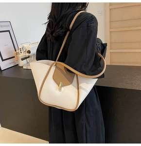 Borsa tote bicolore alla moda con finiture in pelle marrone e chiusura metallica