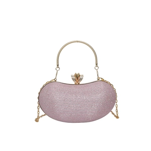 Pink glitter evening clutch with golden round handle and crystal crown clasp detail