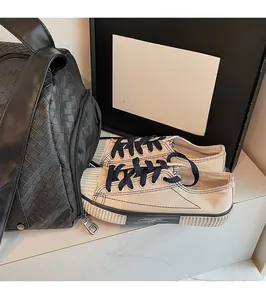 Detail of woven travel bag with dedicated shoe compartment for organized storage