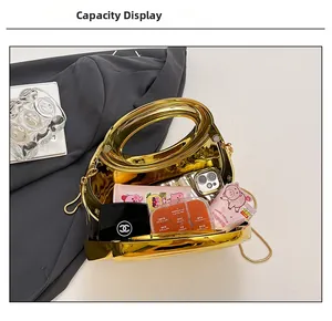 Internal view of gold metallic clutch bag showing storage capacity for essentials