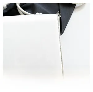 Close-up of premium white leather texture and neat stitching with silver metal buckle