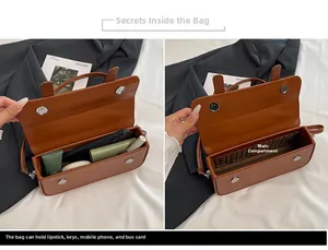 Internal view of brown leather handbag showing spacious main compartment and magnetic snaps