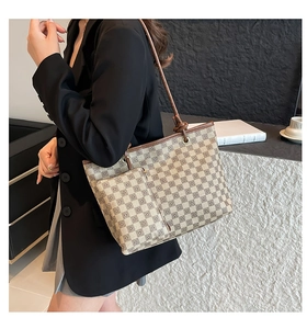 Detail of checkered tote bag set with detachable small pouch and slim shoulder straps