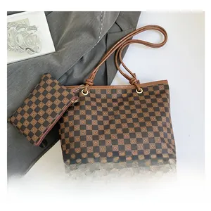 Detail view of vintage checkered tote set including large handbag and matching pouch