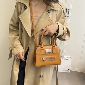 Fashionable ginger yellow crossbody bag with double handles and front zipper pocket