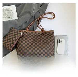 Detail view of large checkered tote bag set with matching pouch and interior dimensions