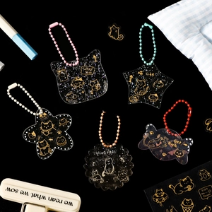 5-piece set of cartoon cat acrylic liquid glitter keychains with gold foil accents