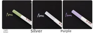 Metallic markers in light green, silver, and purple shown on a black background