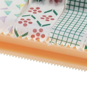 Creative washi tape dispenser set with colorful geometric and floral patterned tapes