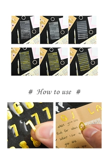 Detail of metallic textured gold and silver alphabet stickers with embossed grid pattern