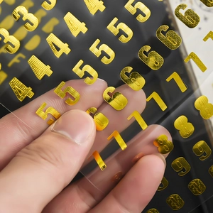 Golden 3D metallic number stickers with wave texture on transparent film background