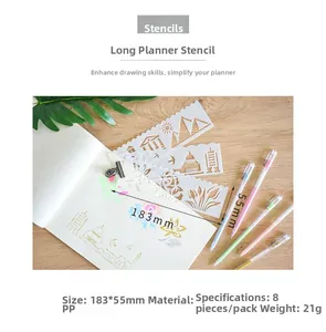 Detail of 8pcs hollow painting stencils on wood desk with notebooks and colored pens