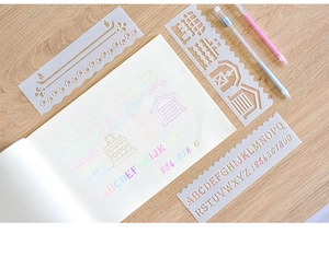 Detail view of flexible drawing stencils with letters, numbers and farm patterns