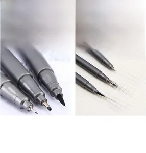 Detailed macro view of professional stainless steel drawing pen tips and ink flow