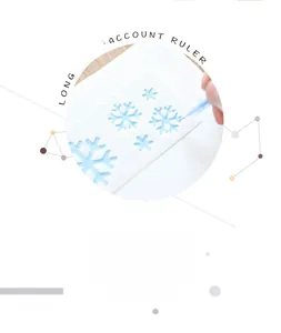 Action shot of drawing a snowflake pattern using a white semi-transparent stencil ruler