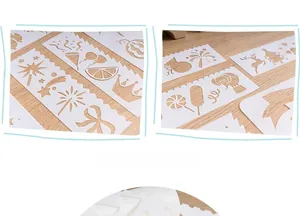 Detail of white flexible plastic drawing stencils with various Christmas hollow patterns