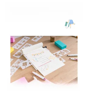 Detailed view of hollow drawing template rulers with windmill and bubble patterns for journals
