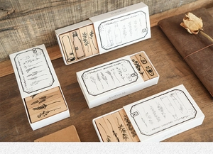 Detailed close-up of vintage herbarium specimen wooden stamps and decorative paper boxes
