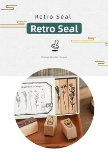 Macro shot of vintage wooden stamp set with botanical bottle designs in white drawer box