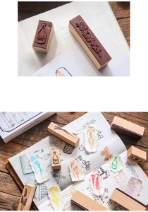 Macro view of vintage lotus wood rubber stamps with floral and bottle designs for scrapbooking