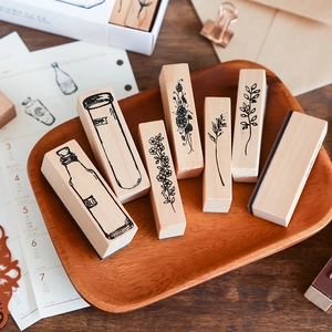6-piece creative wooden stamp set with vintage botanical and apothecary jar patterns