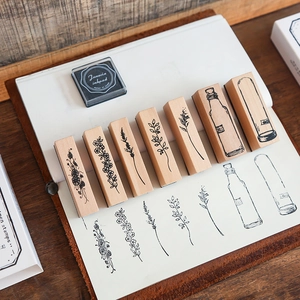 Set of 6 vintage wooden stamps with botanical flower patterns and glass bottle designs