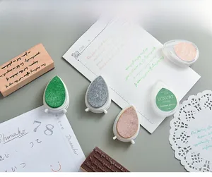 Detailed view of colorful teardrop ink pads for DIY rubber stamps and paper crafts