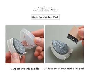 Detail showing silver drop-shaped ink pad application on wooden stamp with protective lid