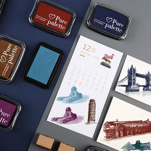 Colorful retro pigment ink pads set with wood stamps on a stylish aesthetic background