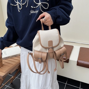 Zaino retrò in tela e pelle con doppie tasche anteriori e patta con coulisse