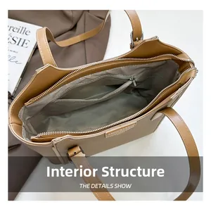 Internal structure detail of large tote bag with satin lining and zippered inner pocket