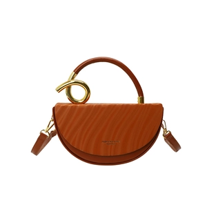 Brown semi-circular box bag with wave texture and gold metal ring handle