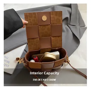 Detailed view of the brown woven bag internal capacity with daily essentials inside