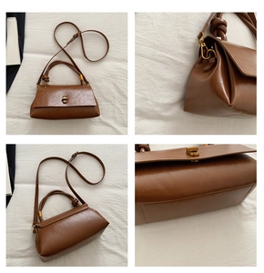Detail view of brown vintage leather crossbody bag with gold buckle and knotted handle