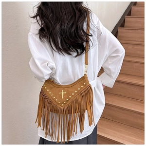 Brown suede crossbody bag with metallic studs, cross charm and long boho fringe tassels