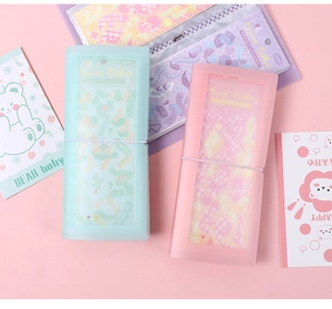 Detail of macaron pastel stickers storage binder with elastic strap and matte texture
