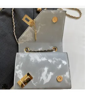 Detail of grey marble pattern PU leather bag showing the strong magnetic closure