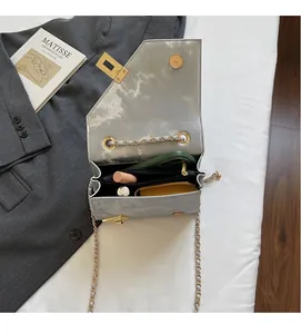 Interior view showing the organized compartments of a marble pattern chain bag
