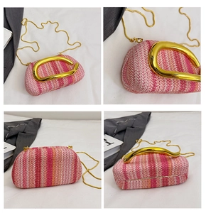 Detailed macro view of woven tricolor straw handbag with golden metal U-handle and chain