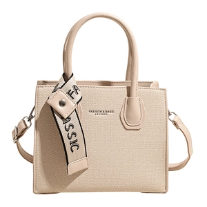 Minimalist beige canvas and leather crossbody bag with letter ribbon decoration